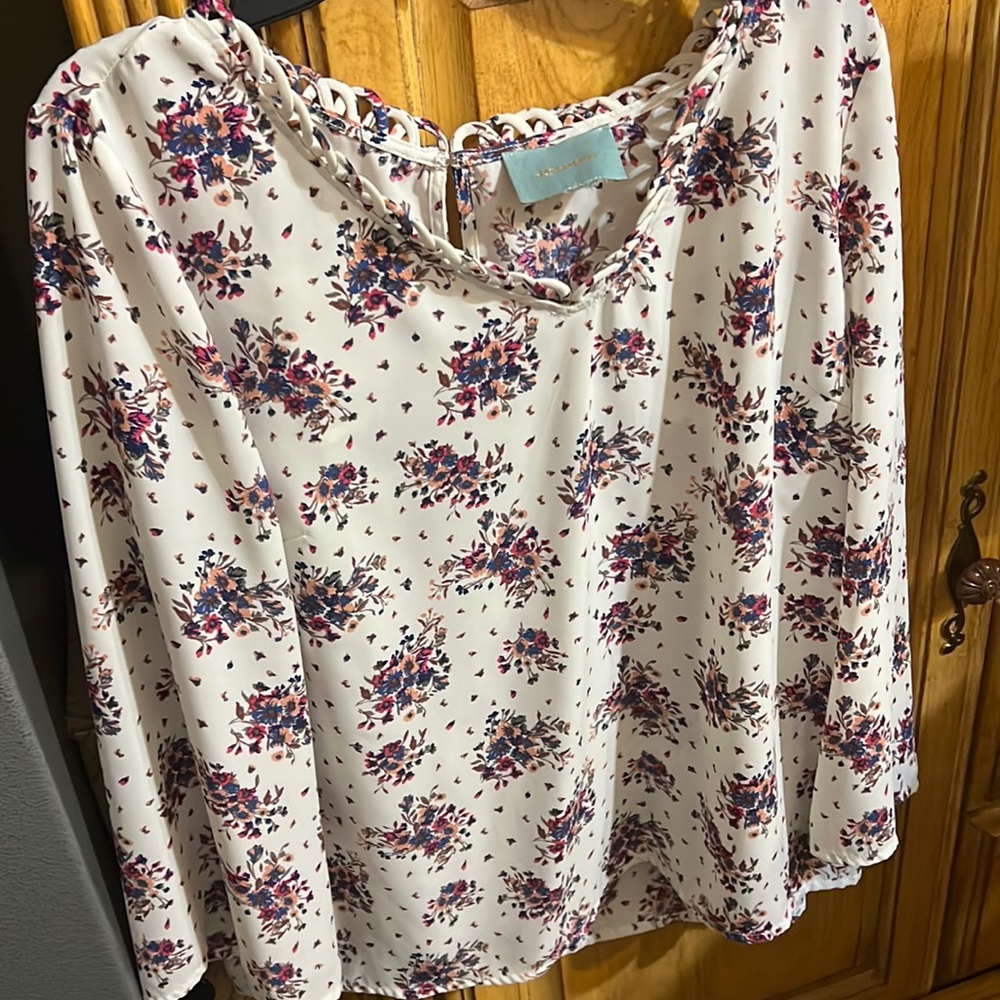Sky’s are blue white and floral blouse